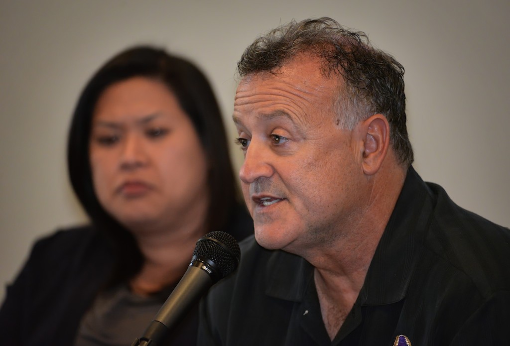 Josef Levy, former (ret.) Commander for the Long Beach PD, talks about how law enforcement can to better when dealing with the mentally ill. Behind him is Tina Rocha, Crisis Response Program Specialist, Orange County Department of Education. Photo by Steven Georges/Behind the Badge OC